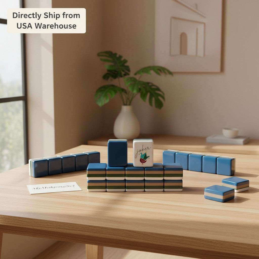 American mahjong tiles in grey and blue acrylic with a joker tile on a wooden table in a bright room