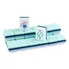 Cyan American Mahjong tiles displayed on a clear acrylic Mahjong rack, featuring premium acrylic construction and elegant navy blue tile backs for a stylish American Mahjong set.
