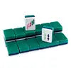 Green American Mahjong rack with matching pushers holding premium acrylic Mahjong tiles, designed for comfortable gameplay and organized tile management.