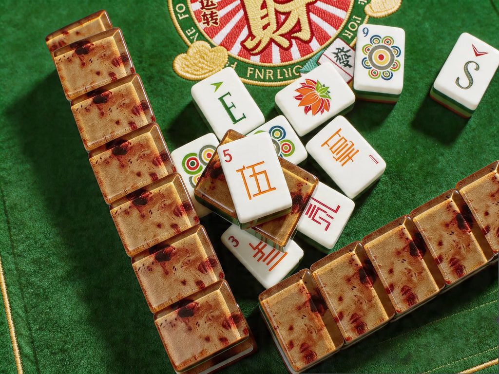 Luxury American Mahjong tiles with wood grain design displayed on a green Mahjong mat