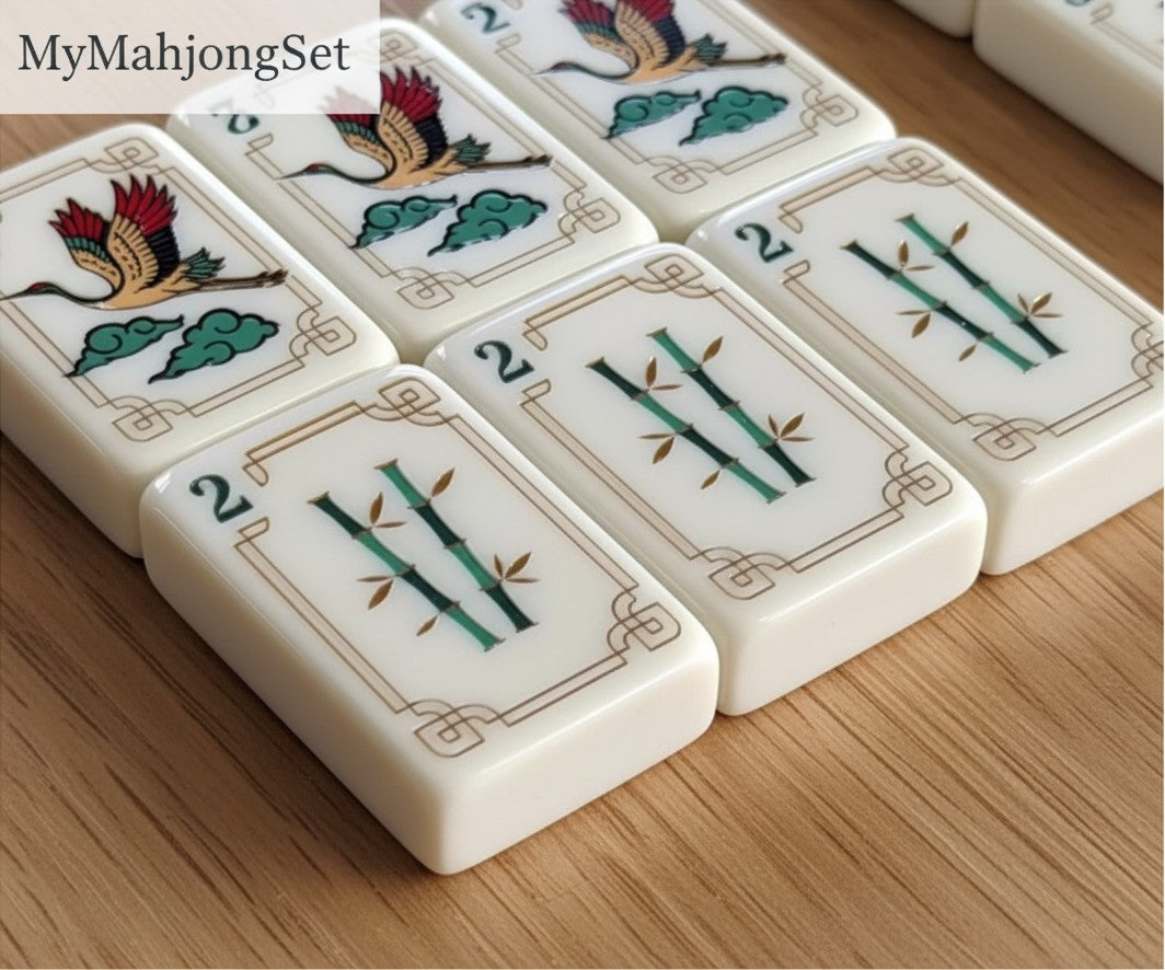MyMahjongSet luxury acrylic American mahjong tiles featuring elegant yellow crane and bamboo patterns on a wooden table.