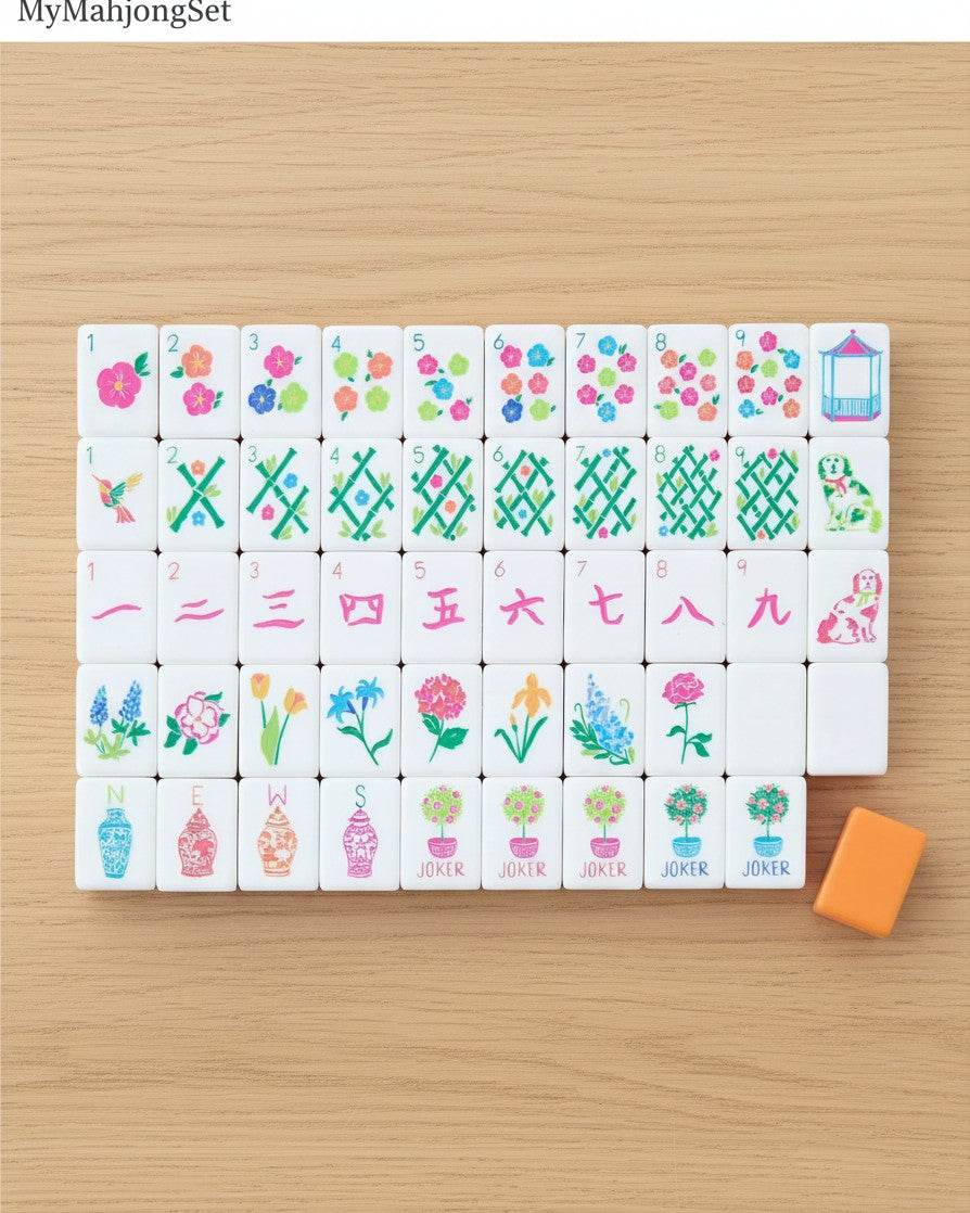 MyMahjongSet acrylic mahjong tiles featuring colorful floral, garden, and animal designs on a wooden surface.