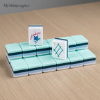 MyMahjongSet acrylic American mahjong tiles with green dragon engraving and joker tile on a wooden table