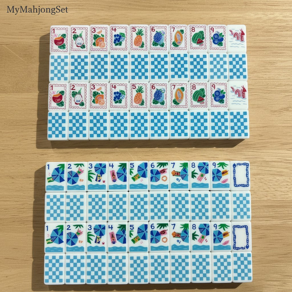 Blue gingham American mahjong tiles with colorful travel and beach vacation icons on a wooden surface