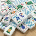 Blue gingham American mahjong tiles with colorful summer-themed travel illustrations