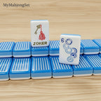 Blue vertical stripe American mahjong tile set with an illustrated Joker tile design