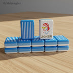 Blue vertical stripe American mahjong tiles featuring an illustrated Joker tile design