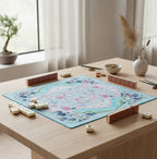 Floral print American mahjong mat styled on a wooden table with mahjong tiles and minimalist decor