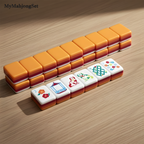 Close-up of American mahjong tiles showing the sunset color-blocked layers and tile designs