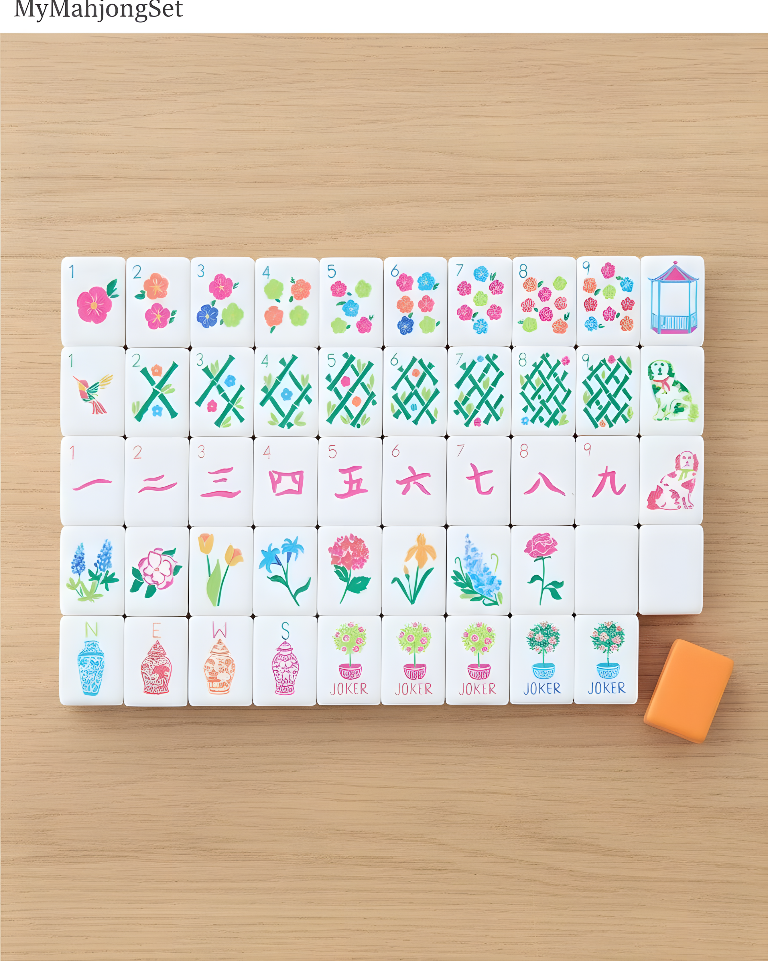 American mahjong tiles laid out showing the full range of colorful suit and character designs