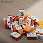 American mahjong tiles scattered on a table showing hummingbird and floral tile illustrations
