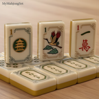 Close-up of American mahjong tiles featuring circle suit and dragon tile designs in an elegant ivory finish