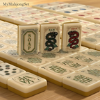 American mahjong tiles set in an elegant ivory finish with dragon and suit designs, arranged on a wooden table
